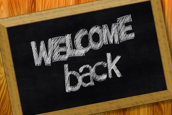 chalkboard with "welcome back" on it